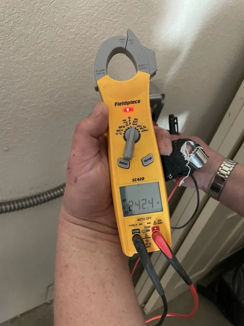 Voltage testing with clamp meter during Generator Installation in East Niles